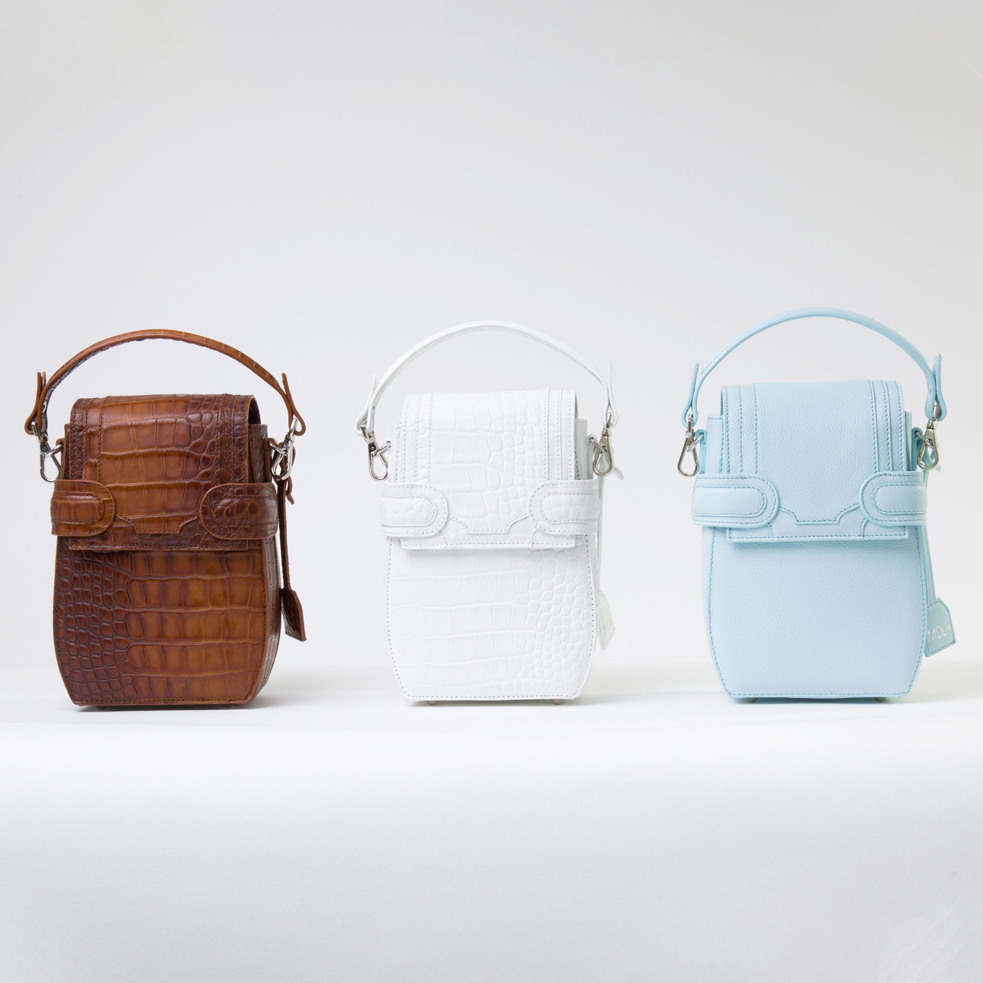 Collection of OCTAVIO 4 WAY BACKPACK, a fashionable backpack with minimalist look available in brown, blue and white