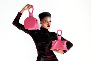 A photoshoot with ATENA PASSION PURSE-SLING BAG, a hot pink bag, hot pink purse, with minimalist look from MDLR