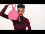Load and play video in Gallery viewer, A studio videoshoot with ATENA PASSION PURSE-SLING BAG, a hot pink bag, hot pink purse, with minimalist look from MDLR
