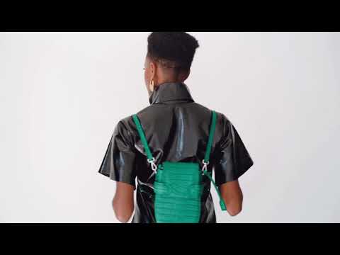 A studio videoshoot for OCTAVIO EMERALD CROC 4 WAY BACKPACK, a cute green backpack with croc look and feel by MDLR