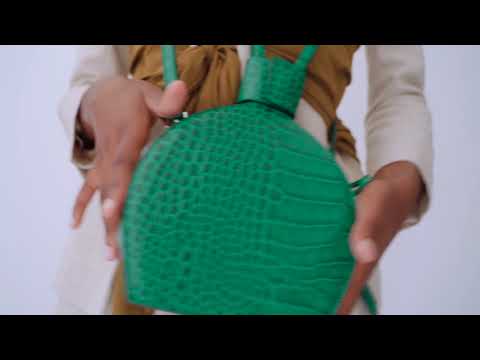 Studio videoshoot of ATENA EMERALD CROC PURSE-SLING BAG, a green bag, green handbag, with croc look from MDLR